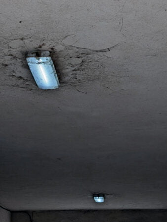 Spider webs covering an emergency bulkhead