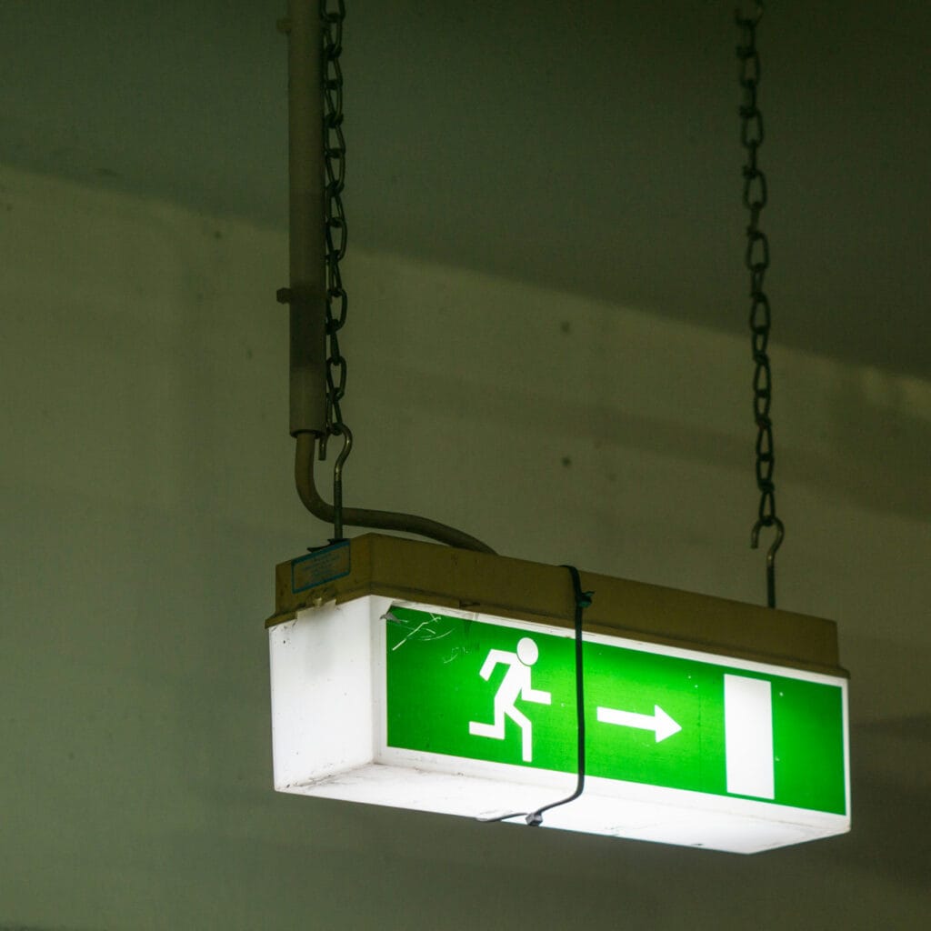 Emergency Exit Sign held together by Zip ties